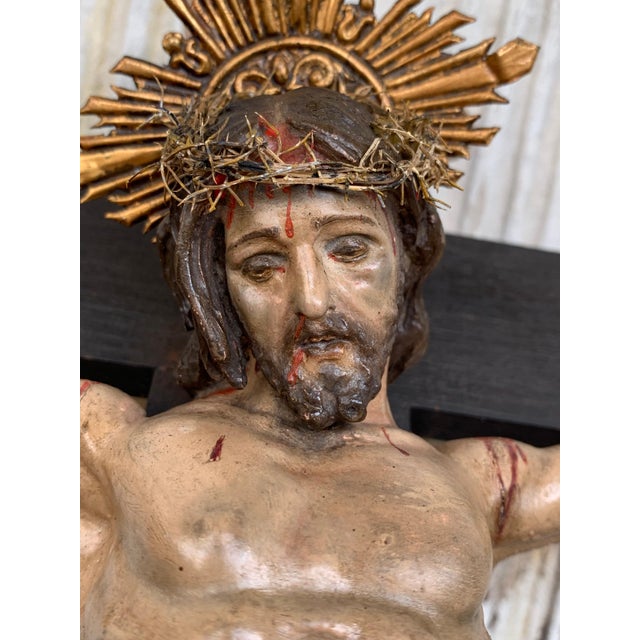 Crucifix from the mid-1800s with a carved shroud or veil depicting Christ in the base. This unique and remarkable antique...