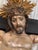 Crucifix from the mid-1800s with a carved shroud or veil depicting Christ in the base. This unique and remarkable antique...
