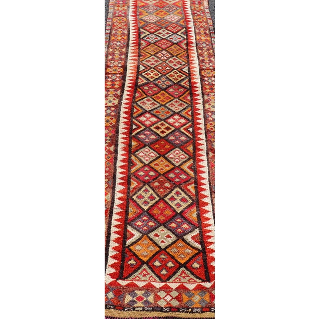 Measures: 2'9 x 9'10 Multicolored Midcentury Turkish Kurdish Oushak Runner with Diamonds and Stars. Keivan Woven Arts /...