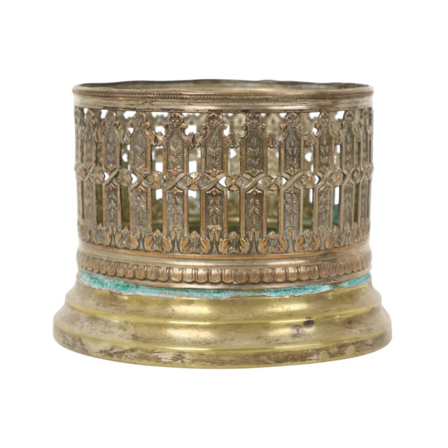 Antique wine bottle holder made of silver-plated metal, beautifully adorned with Neoclassical-style ornaments and richly...