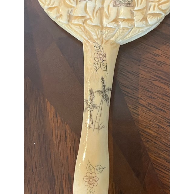 Beautiful antique magnifying glass with a carved bone with two elephants carved.