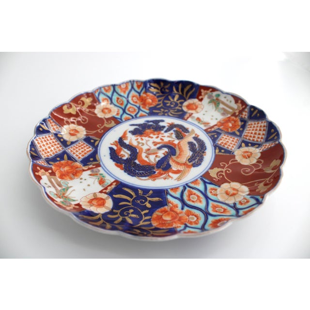 Antique Japanese Imari Scalloped Plate with Hand Painted Phoenix and floral motif in the traditional underglaze of blue,...