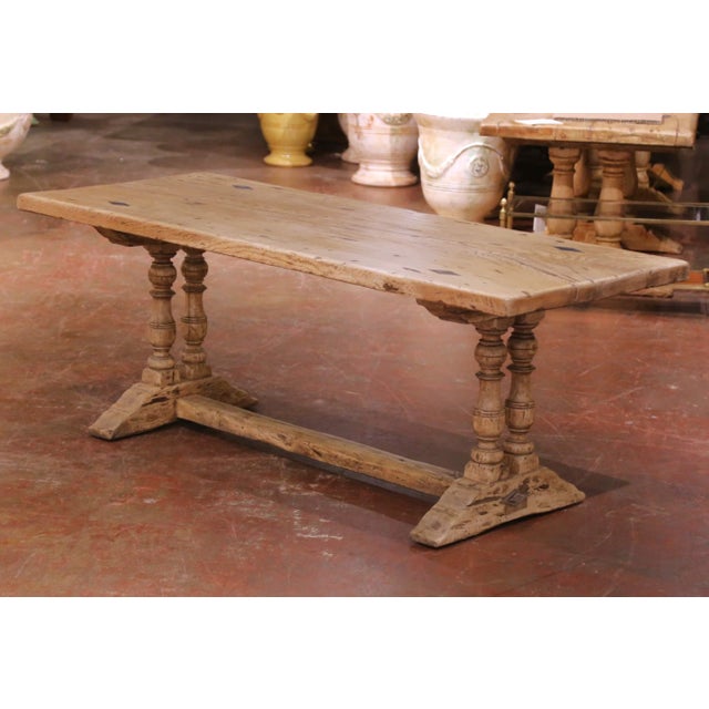 Crafted in France circa 1870, this elegant antique oak refectory table reflects the enduring strength and restrained...