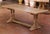 Crafted in France circa 1870, this elegant antique oak refectory table reflects the enduring strength and restrained...