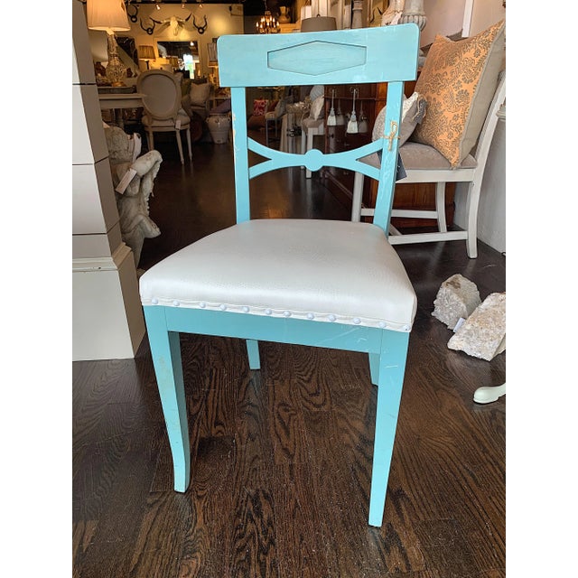 Antique Swedish chairs with original paint. We added a fun white leather fabric on the seat with matching white nail heads.