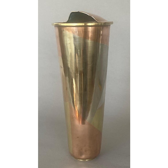 Here's a striking example of superior Mexican metal craftsmanship and design -- a vintage hand-wrought cocktail shaker....