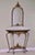 Oscar Bach attributed gilded iron console with a black marble top and arched, beveled mirror, circa 1920. A gorgeous set...