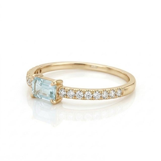 Enhance your hand with the delicate shimmer of this extreme light aquamarine solitaire ring. Featuring a pale, icy-blue...