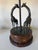 Striking and sculptural pair of vintage Maitland-Smith table lamps featuring elegant bronze giraffes gracefully encircling...