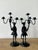 This striking pair of vintage forged iron candelabras is a masterful example of mid-century artisanal metalwork. Each...