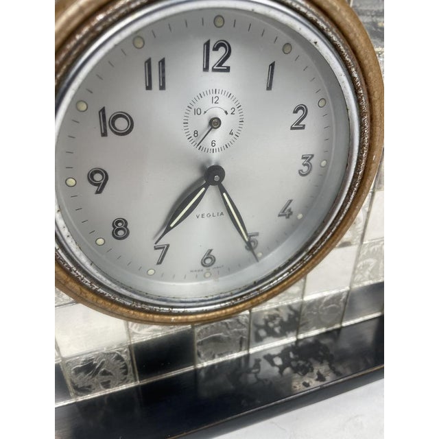 Beautiful and antique Liberty mirror clock with rabbits from the 1920s. Excellent furnishing item.