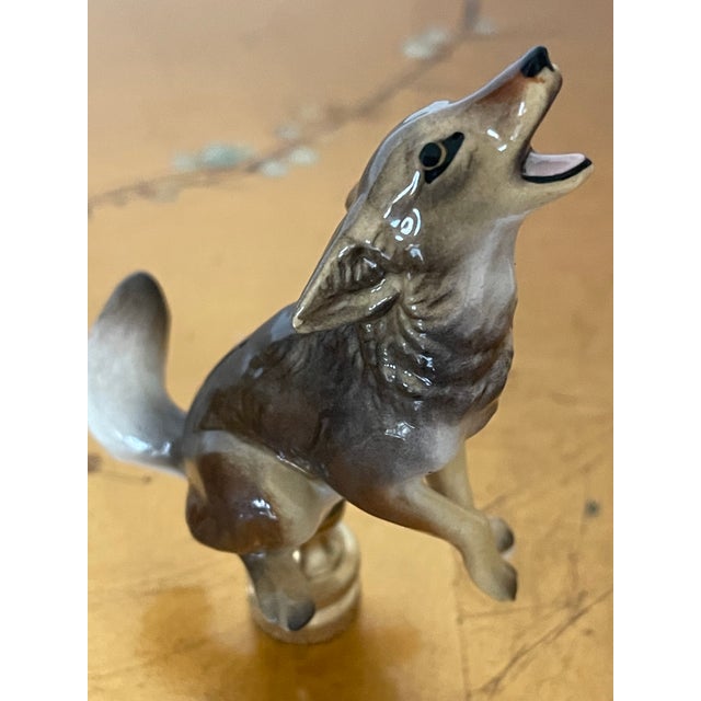 Charming pair of wild animals polychrome glazed ceramics figurines on brass bases as lamp finials.