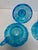 A striking two-piece set of vintage Fostoria Coin Glass in brilliant light blue press glass. First introduced by Fostoria...