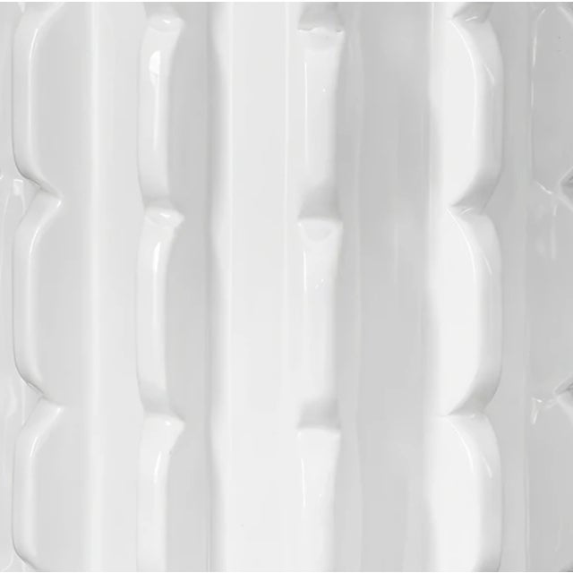 Elegant and timeless, this scalloped ceramic table lamp brings refined style to any room. The white glazed ceramic base...