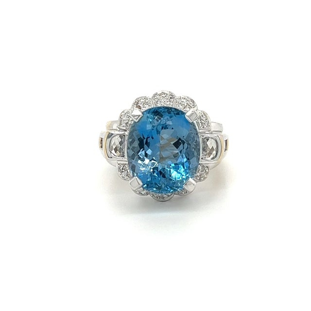 GIA Certified Oval Cut 9.5 Carat Aquamarine Ring, elegantly crafted in 18K White Gold. Adorned with 42 round cut diamond...