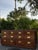 A beautifully crafted vintage Henredon campaign-style dresser, showcasing the exceptional quality and timeless design that...