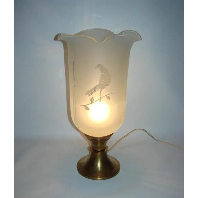 Table lamp, the 1940s, was made of brass and matte glass. The lamp is preserved in good condition and requires an E27...