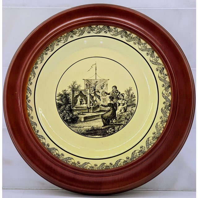 Charming framed creamware plate decorated with a black transfer scene after the famous French Creil Panorama series. Cupid...