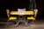Mid-century "Plasticove" dinette set featuring a drop-leaf laminate table and three matching vinyl chairs. The tabletop is...
