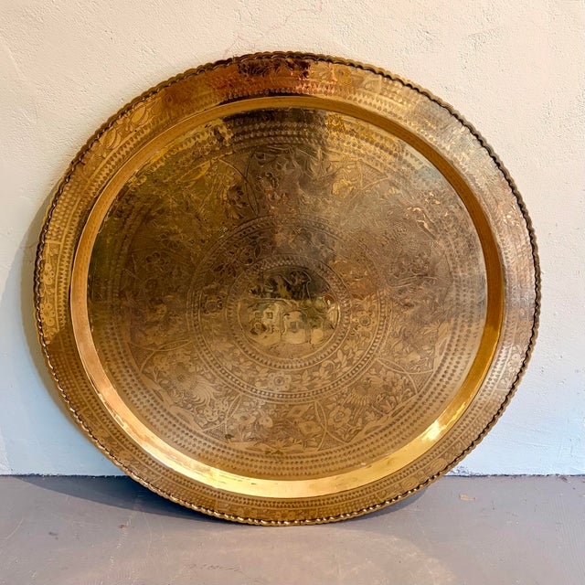 A spectacular oversized vintage brass tray or wall art piece featuring beautifully detailed etched decoration throughout....