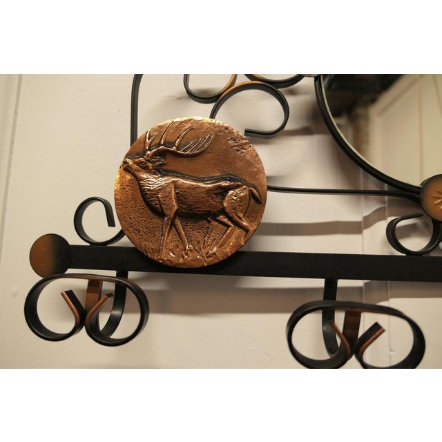 French iron and copper hall coat hooks with mirror. This is an attractive wall hanging mirror with 4 coat hooks beneath it...