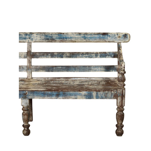 Antique Indian Painted Teakwood Bench, c. 1900-30, from Rajasthan in the Anglo style with turned legs, rolled arms, and a...