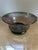 A vintage Mexican hand-blown glass bowl distinguished by its luminous purple hue and delicately applied green detailing...