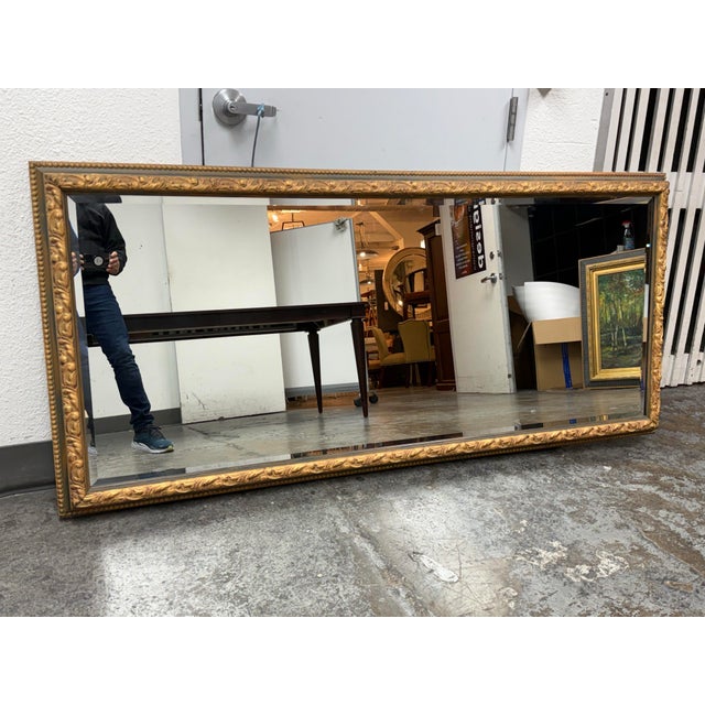 Design Plus Gallery presents a Custom Design Carved Wall Mirror. This large rectangular antique-style floor mirror...