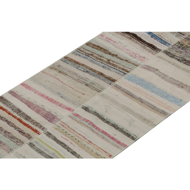Rug & Kilim presents a contemporary 3x25 oversized runner from their innovative new patchwork kilim collection. On the...