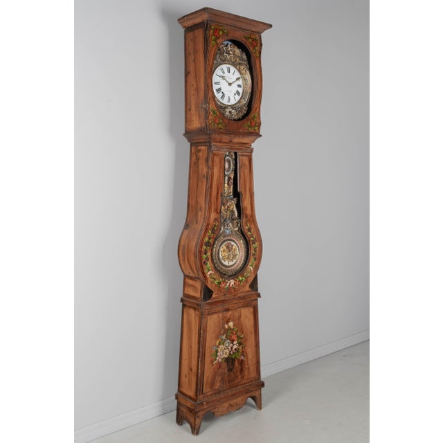 A 19th century Country French comtoise, or grandfather clock, with polychrome painted pine case and embossed brass...