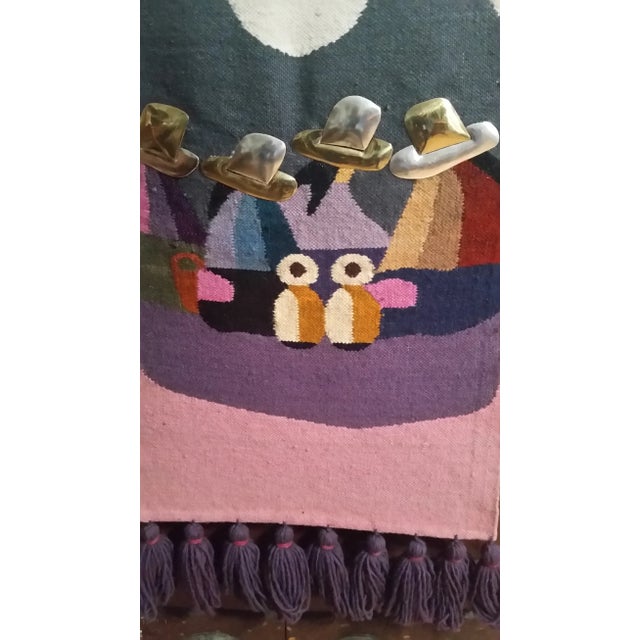 Here's a nice tapestry from the Folklore studio of Olga Fisch, Quito, Ecuador. It features women in native costume with...