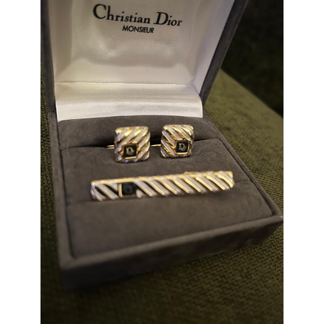 Vintage Christian Dior Gold Plate & Onyx Cufflinks Circa 1990 In Original Case Featuring a front Dior logo, a textured...