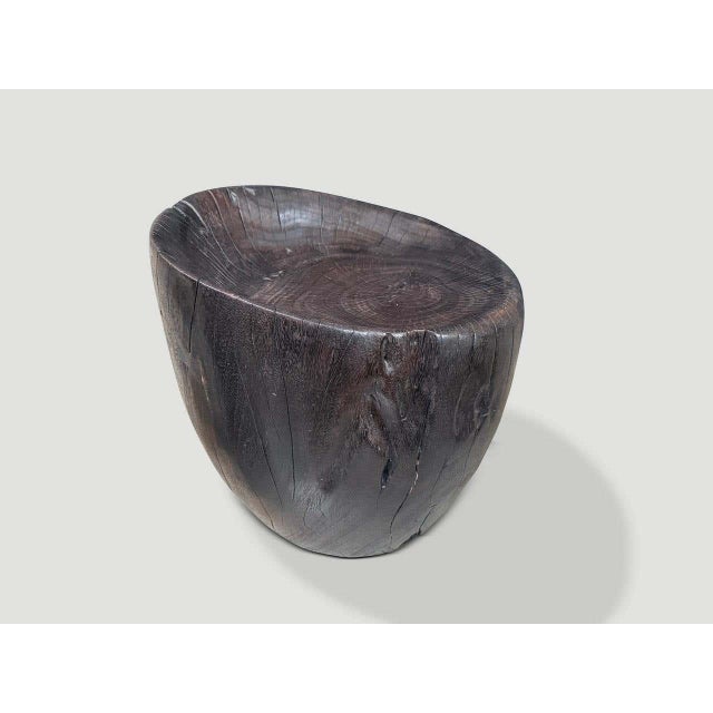 "Beautiful chair hand carved from a single block of wood. Charred to an espresso tone revealing the unique wood grain....