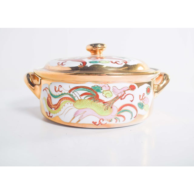 Pot with two handles, in Chinese porcelain. Gold and polychrome decoration, with centipede dragons and mythical birds....
