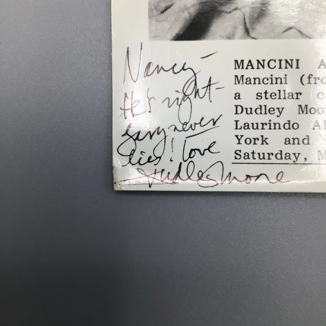 Here is a signed by Dudley Moore photograph of a kvie public television special that was a tribute to Henry Mancini. It is...
