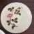 Listing is for a pair of antique porcelain plates. Each is hand decorated with a pink flower and the scalloped rim has a...