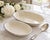 A timeless pair of vintage Lenox Montclair oval serving bowls crafted in Lenox’s signature warm ivory china and finished...