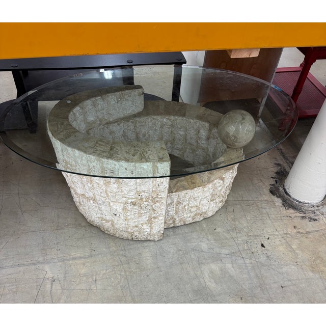 Magnussen Ponte Style Coffee Table . Polished Marble Style Ball and Tessellated Base with an Oval Glass Top.