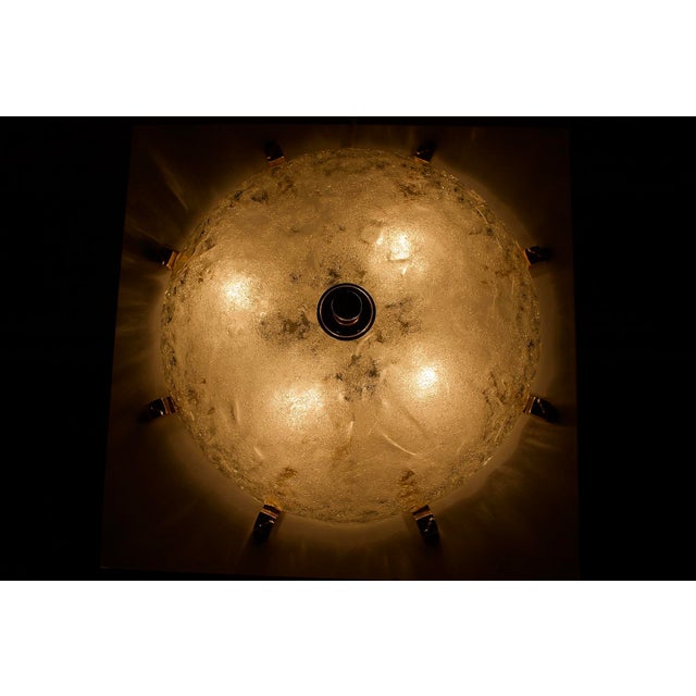 Ceiling light (or wall light) in murano glass with frosted texture, surrounded by 8 textured claws in golden brass....