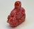 Pink color stones are so attractive, and this odd shape stone is made more beautiful because a carver turned it into an...