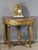 Late 19th-century Directoire-style giltwood console table. This half-moon console table rests on four legs joined by a...