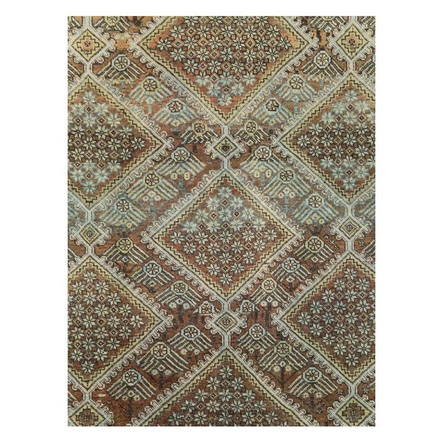 This early 20th-century Persian Afshar small room-size carpet presents a highly structured geometric composition arranged...