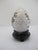 Vintage Chinese Cloisonne metal egg. White background with colorful hand painted enamel bird and lotus flowers amongst...
