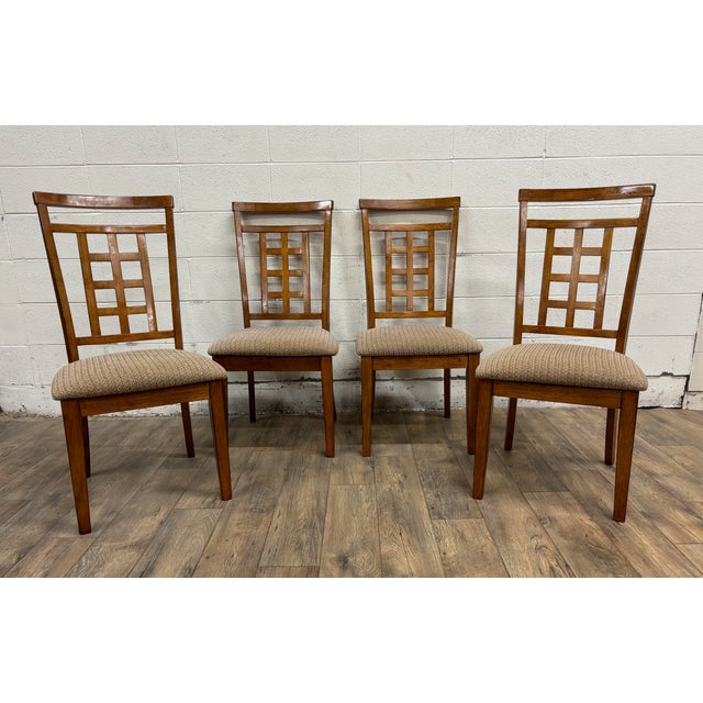 This is a beautiful set of four Cross Island dining chairs by Ashley Furniture. These are solid and sturdy, with only...