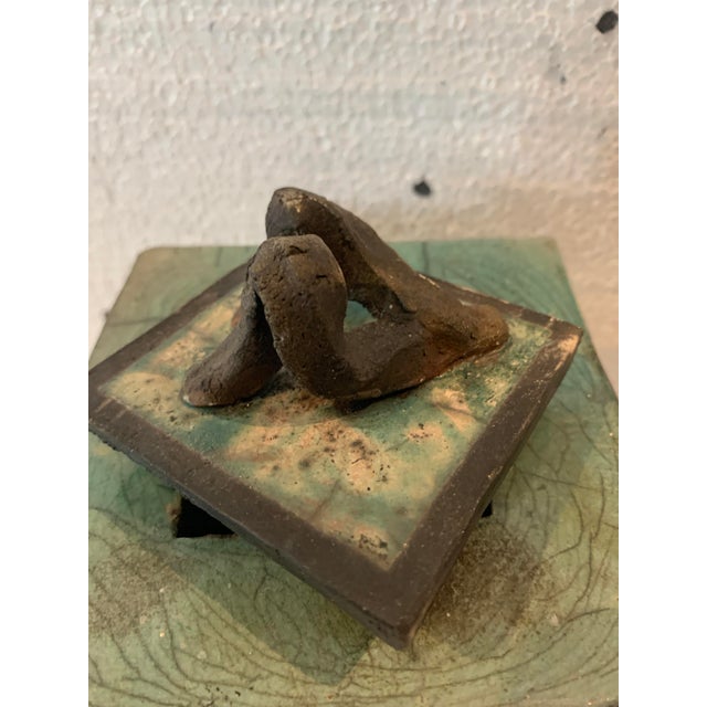 Glazed ceramic box rectangular box with removable lid green background with black rim signed by the artist "j gallart"...