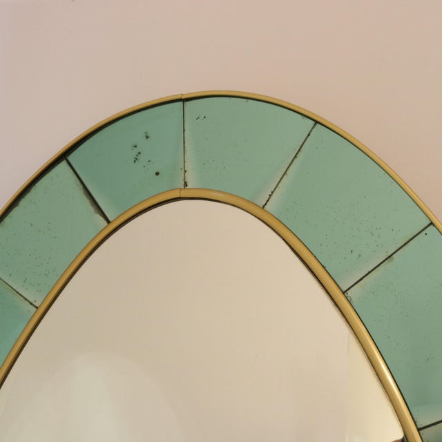 Cristal Arte large scale oval floor mirror model #2690. A frame of beveled, colored, crystal glass is outlined by brass...