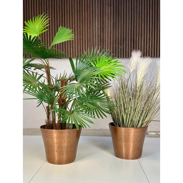 A set of simple yet elegant copper plant pots, made in Germany in the 1960s. Each of these high-quality pots features a...