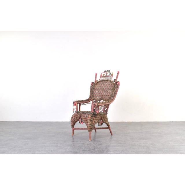 This original Victorian wicker armchair was manufactured in the early 20th century by the American company Heywood-...