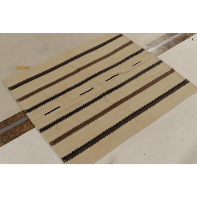 Connoting mid-century Turkish panel-weaving styles circa 1950-1960, a 5x6 vintage kilim rug in handwoven wool. This...
