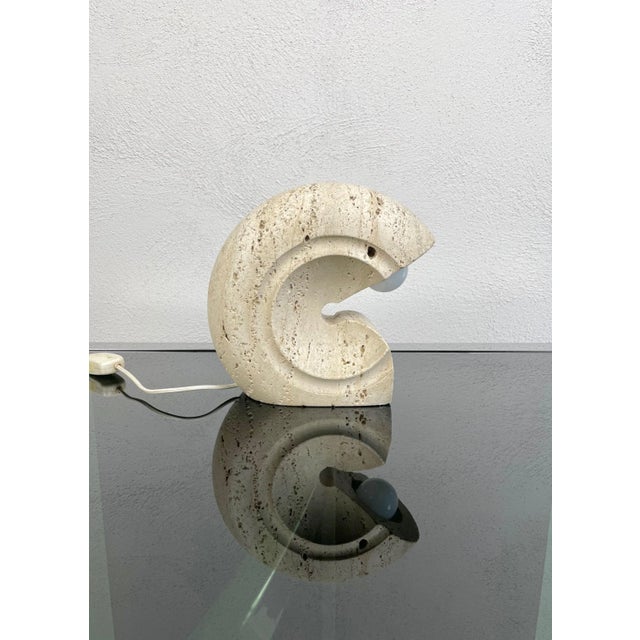 Carved travertine marble table lamp designed by Giuliano Cesari manufactured for Nucleo Sormani, Italy, circa 1970s. The...